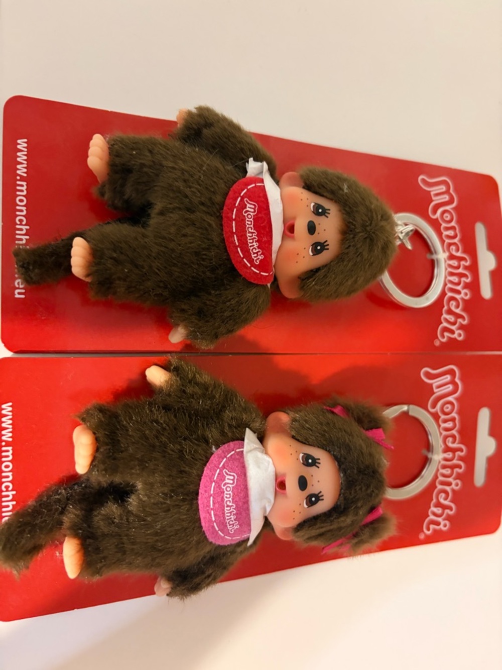 Monchhichi boy and girl twin babies with bibs